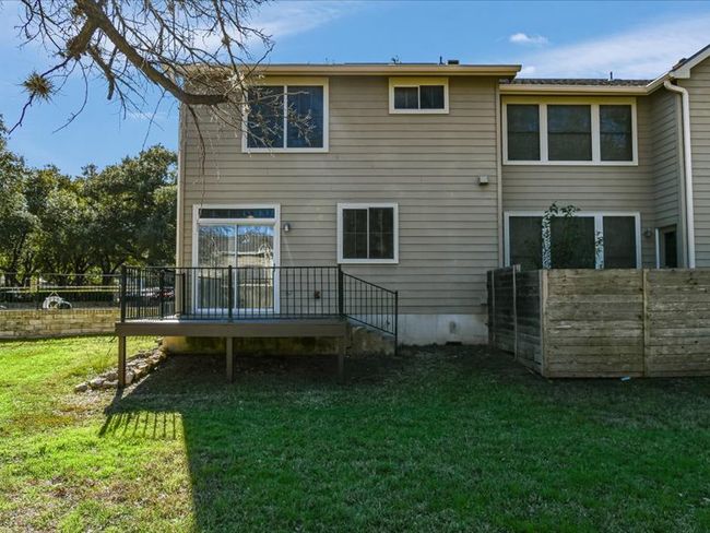 Back of property featuring fence, a yard, and a wooden deck | Image 26