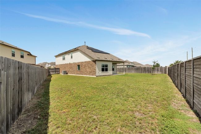 View of fenced backyard | Image 32