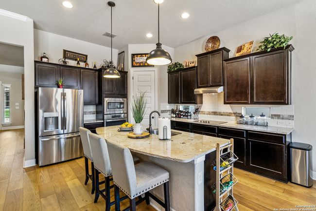Stylish kitchen bar with sleek countertops and com | Image 19