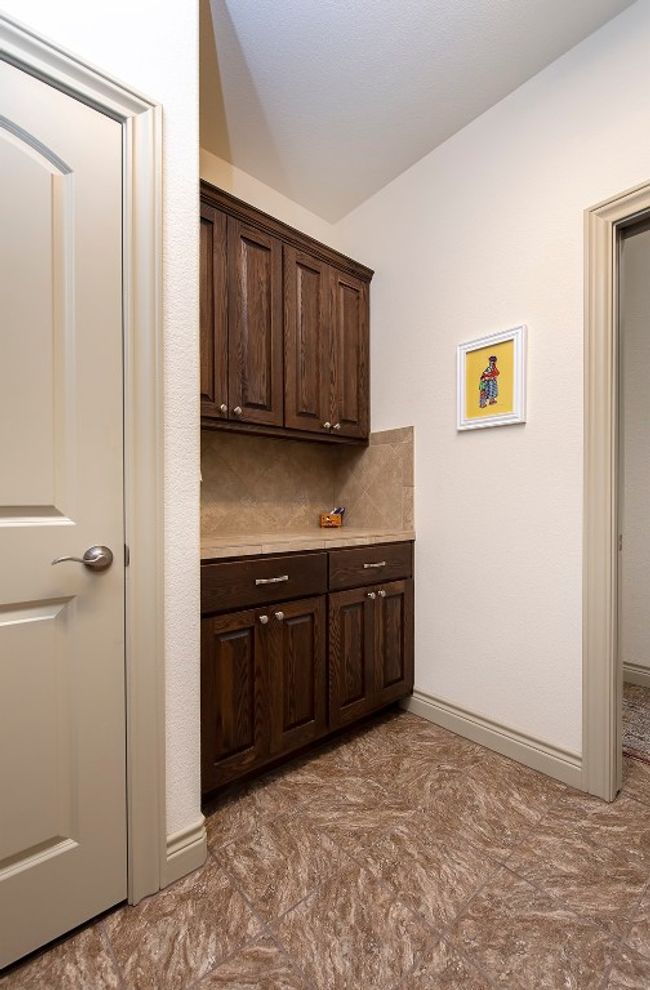 Laundry area and access to bedroom hallway. | Image 13