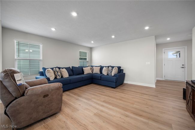 Living room with a wealth of natural light, recessed lighting, and light wood-style flooring | Image 15