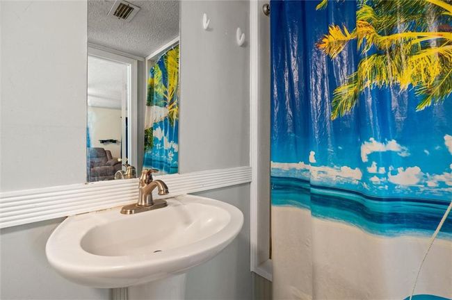 Full bathroom with ceramic tile. | Image 11