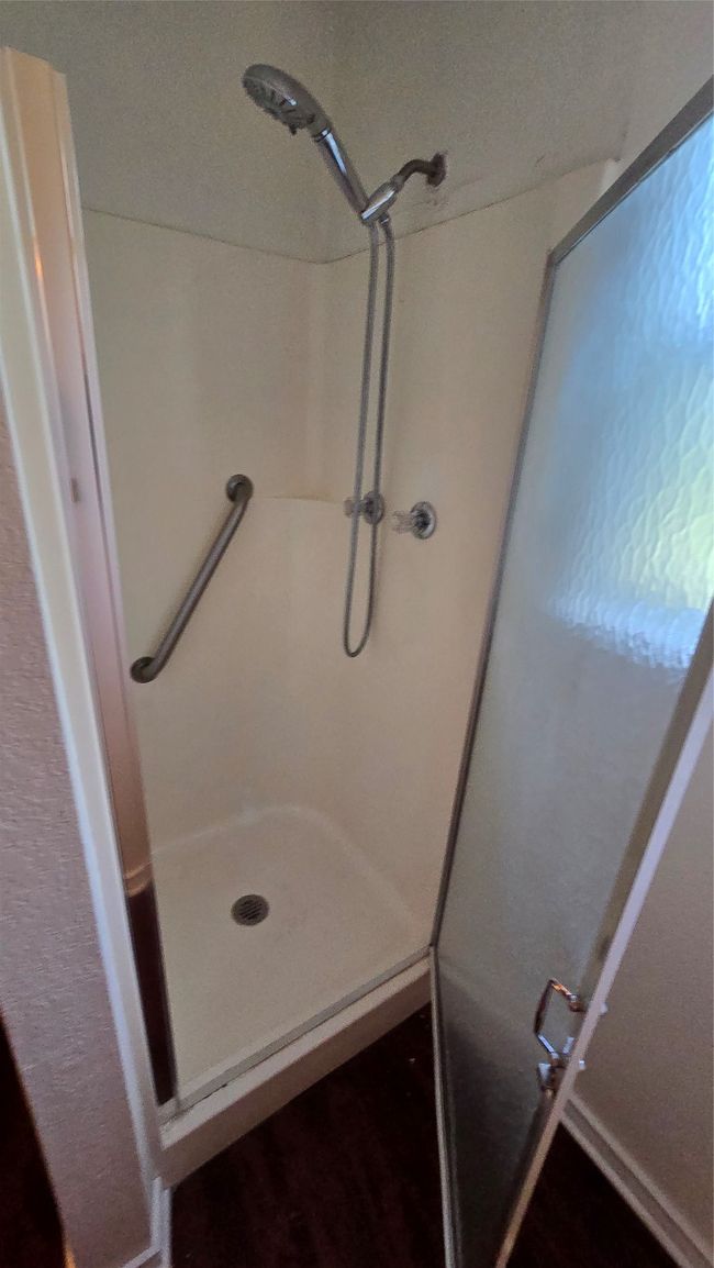 Bathroom featuring a shower stall | Image 20
