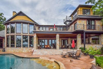 Back of property with a patio and a balcony | Image 1