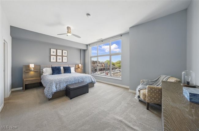 Carpeted bedroom with baseboards and a ceiling fan | Image 20
