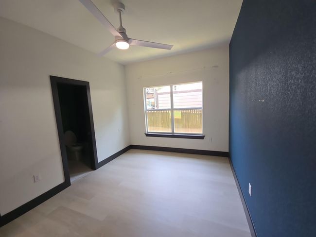 Unfurnished room featuring ceiling fan and light wood finished floors | Image 12
