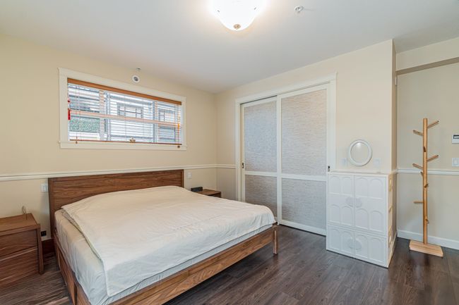 Bedroom featuring dark wood-type flooring and baseboards | Image 21