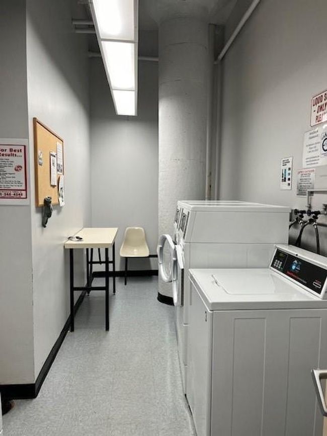 Laundry room featuring independent washer and dryer, hookup for a washing machine, and light tile floors | Image 12