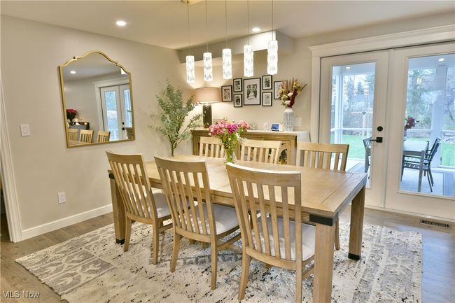 Dining area featuring visible vents, recessed lighting, wood finished floors, french doors, and baseboards | Image 11