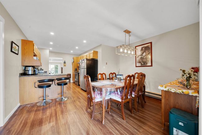 Dining area with light wood-style flooring and recessed lighting | Image 5