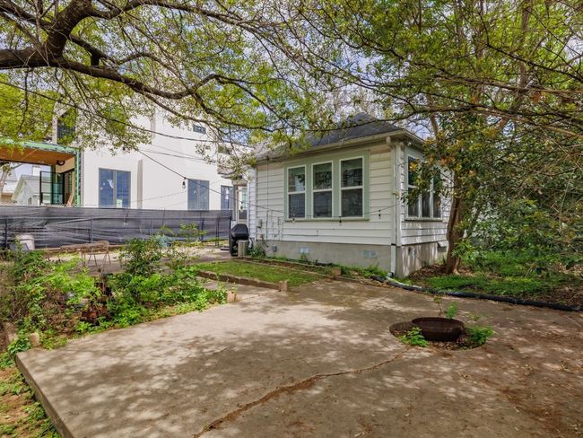 We have permit to remove large tree towards middle of the yard. | Image 25