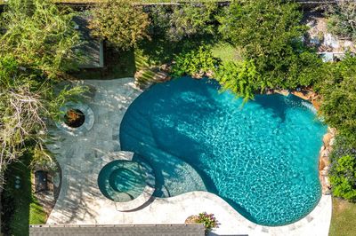 This aerial view shows you the private oasis that is just yours to enjoy with those you hold dear! Wonderful trees and gorgeous travertine surround the sparkling water! | Image 2