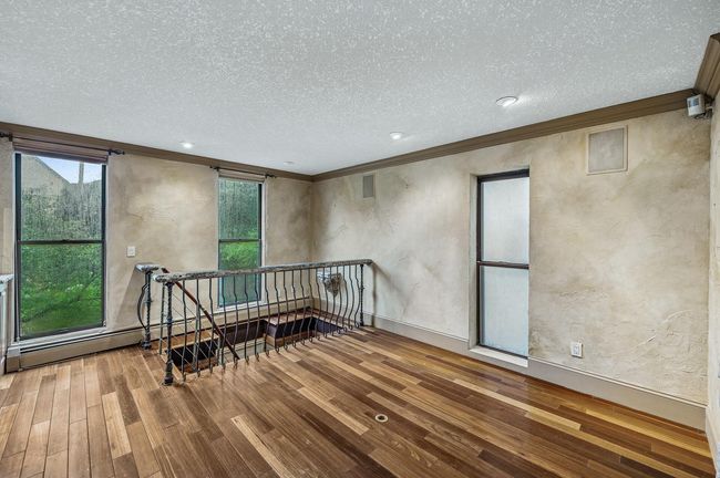 The adjacent space is a great sitting or dining area | Image 19