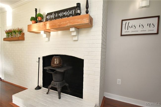 and a beautiful wooden mantel. | Image 16