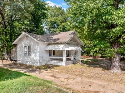 View of property exterior with a porch | Image 2