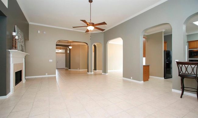 A lovely floorplan that makes entertaining a breeze! Kitchen and formal dining RM to the right with entry straight ahead. | Image 8