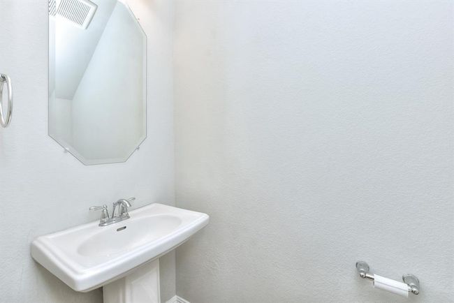 Carpeted empty room featuring ceiling fan and baseboards | Image 13