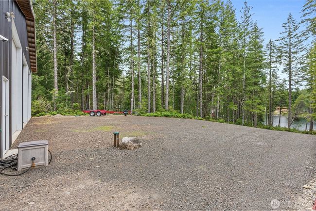 Here is a large parking area on the lakeside of the garage. You can see the stub for the well here. | Image 26