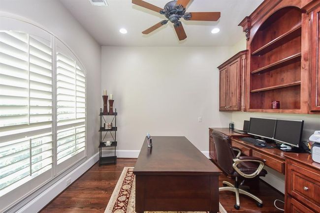 Step away to the quiet and secluded study with great outdoor views. | Image 16