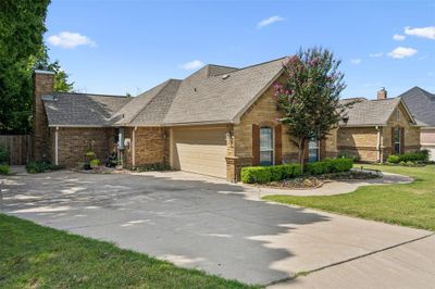 View of front facade featuring a garage and a front lawn | Image 2