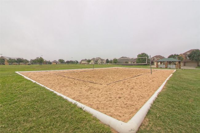 View of property's community featuring a gazebo, volleyball court, a yard, and a residential view | Image 38