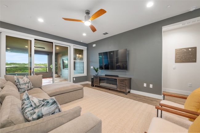 This expansive family room is versatile, functional and elegant featuring a wall of windows overlooking Shoal Creek Greenbelt! | Image 16