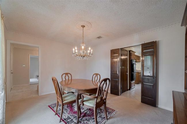 View from the formal living room toward the foyer with easy access to the kitchen. | Image 17