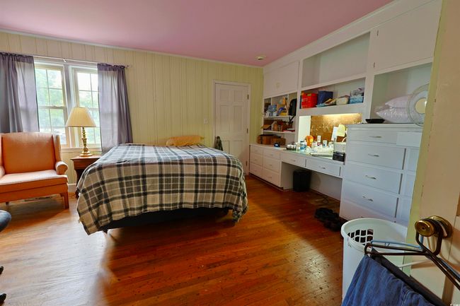 Bedroom featuring dark wood-style flooring | Image 10