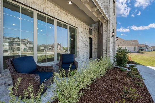 View of side of home with brick siding and a residential view | Image 32