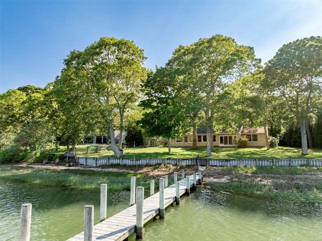 Dock area featuring a water view and a lawn | Image 42