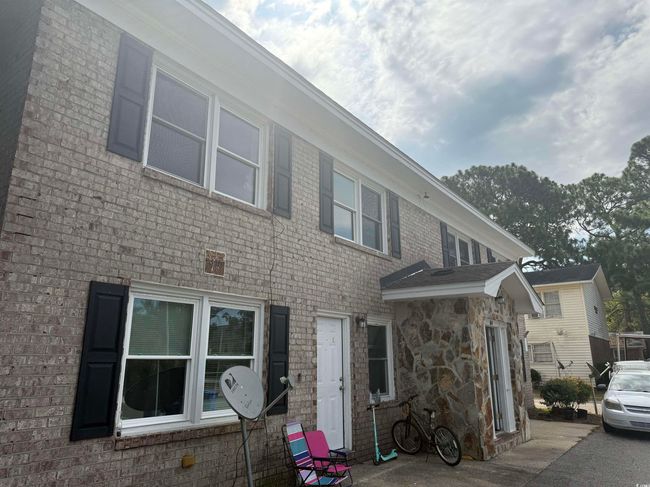 View of front of home with brick siding and stone siding | Image 5