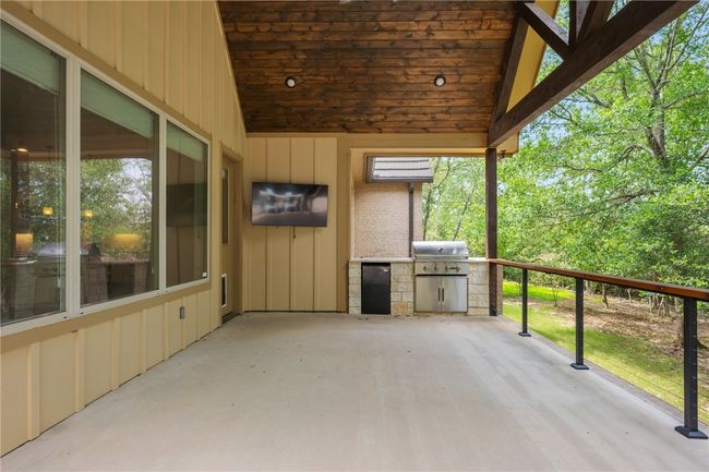 View of patio with grilling area and an outdoor kitchen | Image 26