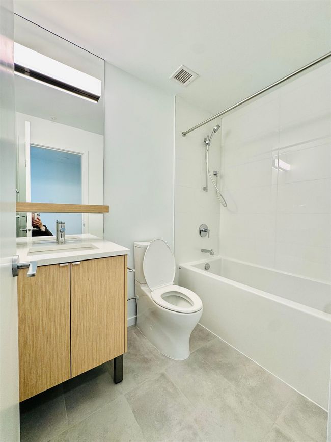 Full bath with toilet, shower / bath combination, vanity, and visible vents | Image 14