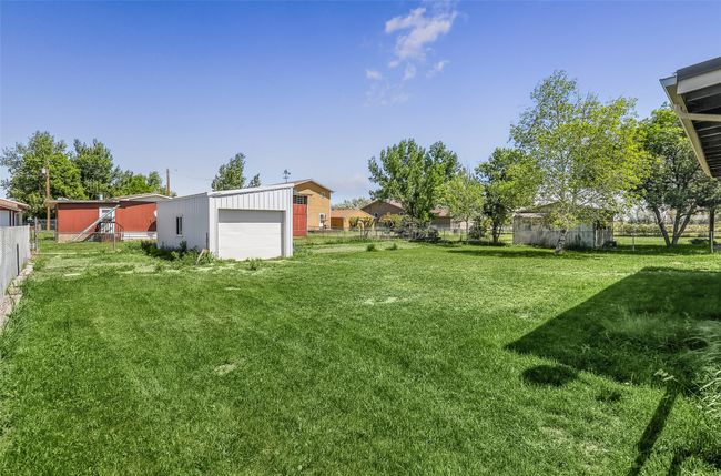View of yard featuring an outbuilding | Image 34