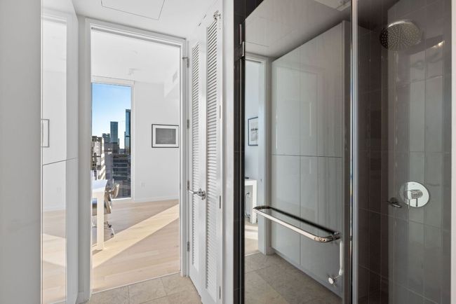 Bathroom with tile patterned floors and tiled shower | Image 19