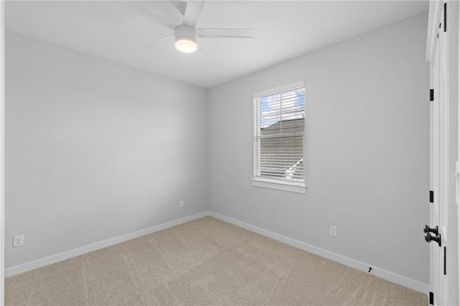 Carpeted empty room with ceiling fan | Image 26
