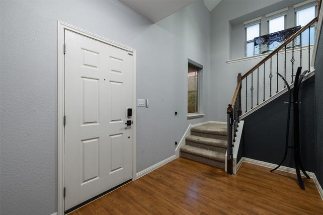 Impressive two story foyer with bump out window and storage closet under staircase. | Image 4