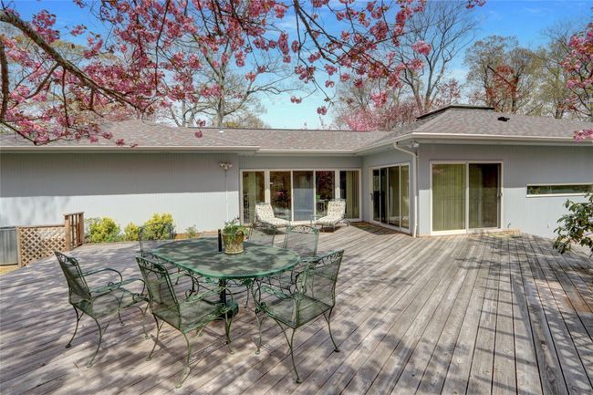 Wooden deck featuring outdoor dining space | Image 32