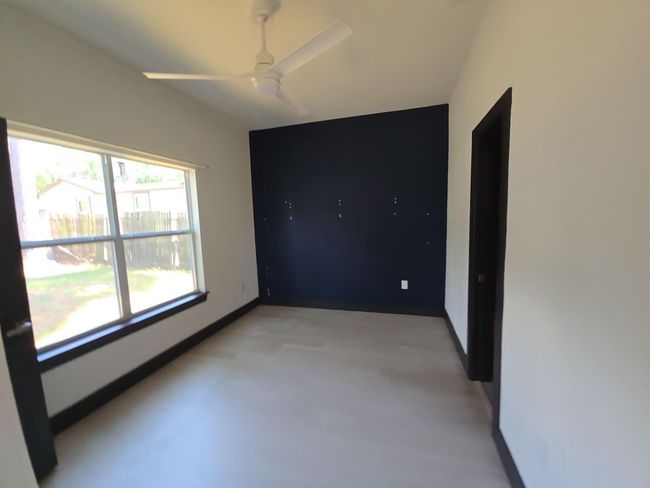 Unfurnished room with a ceiling fan and baseboards | Image 13