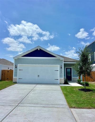 The Dogwood is a beautiful, one story home with beautiful siding and stone to create a modern, updated look you will love. | Image 1