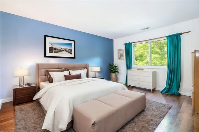 Bedroom with wood-type flooring | Image 6
