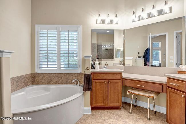 Primary bathroom with separate tub and walk-in shower | Image 33