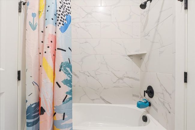 Bathroom featuring shower / bath combo with shower curtain | Image 27