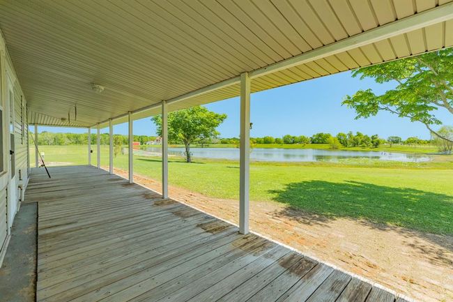 Great Place to hang a swing or add some rocking chairs! Can't beat that view! | Image 13