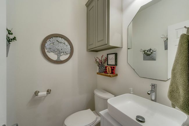 Bathroom featuring sink and toilet | Image 19