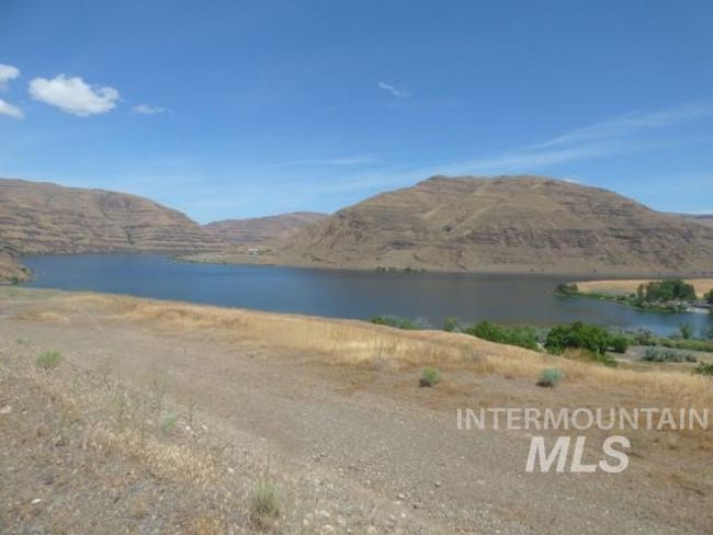 Water view with a mountainous background | Image 24