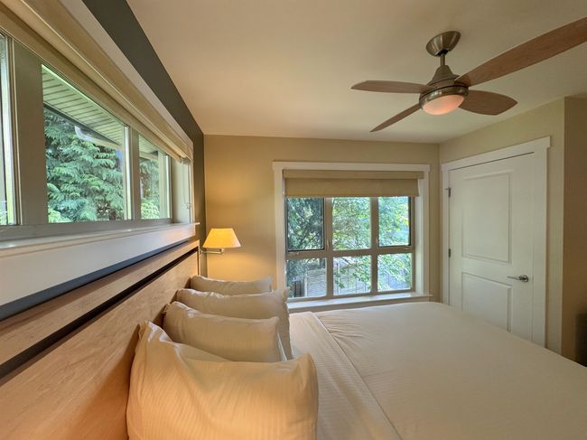 Bedroom with a ceiling fan | Image 19