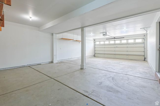 Garage featuring a garage door opener, 2 car wide, 2 car deep | Image 4