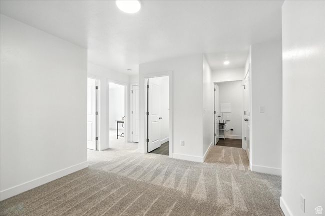 Carpeted spare room featuring baseboards and recessed lighting | Image 8