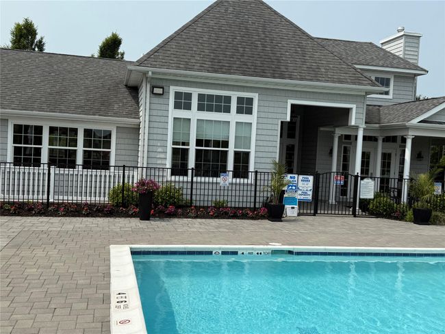 Community pool with a patio | Image 24